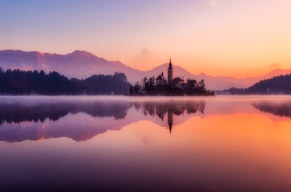 Sunset view of the famous island church. Lake Bled, Slovenia