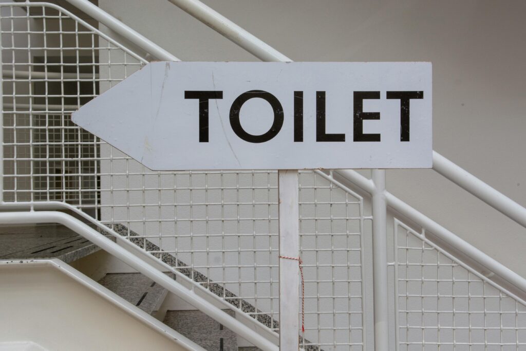 A toilet sign in an airport