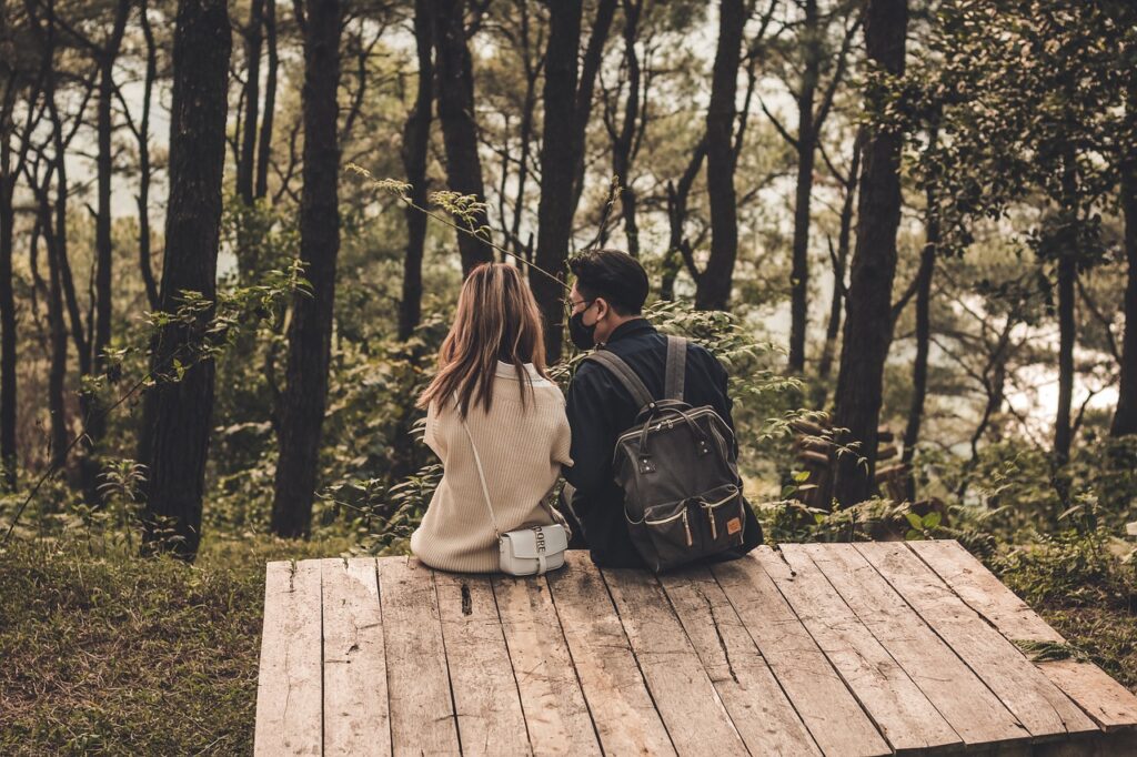 Romantic couple sitting in a forest
