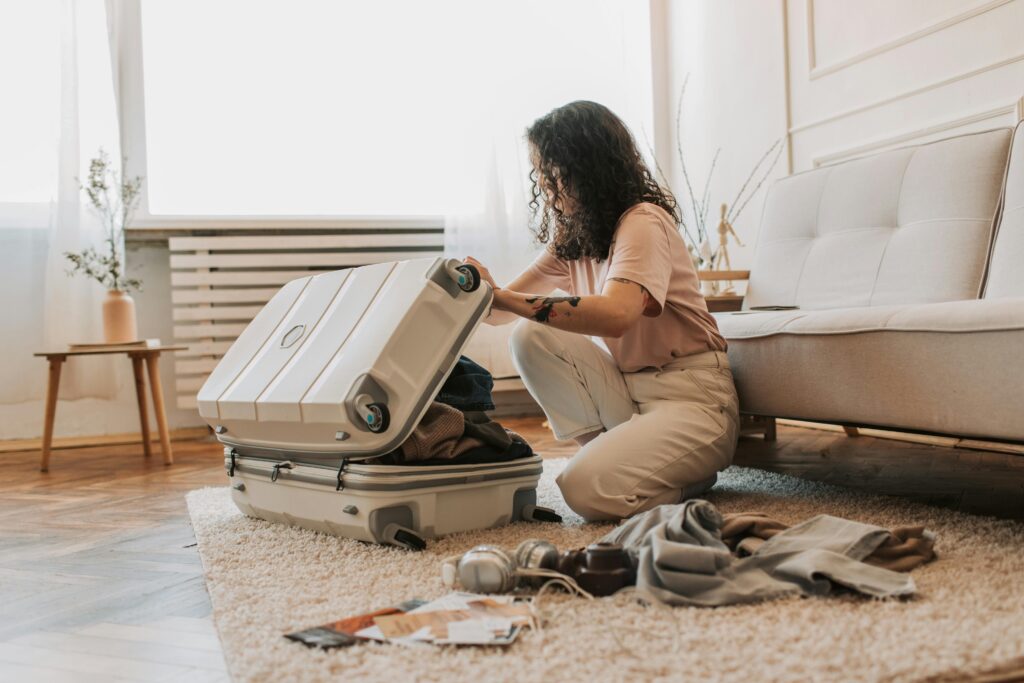 A woman packing her clothes for traveling
