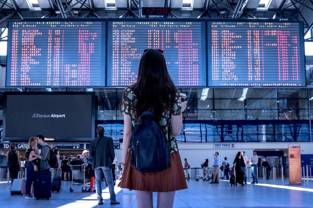 Woman looking at a flight screen